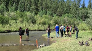 a group of citizen scientists collecting water samples