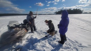 A group of tribal citizen scientists collecting a soil sample in Penobscot, Maine