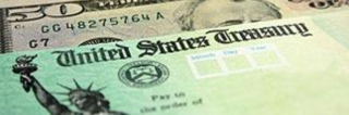 Image of U.S. 50 dollar bill behind a check from the U.S. Treasury.