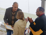 Charles Allen handing Mayorial Document to Amanda Moore