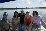 People on a boat in the Caño Martín Peña