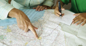 Group of people looking at a map on a table