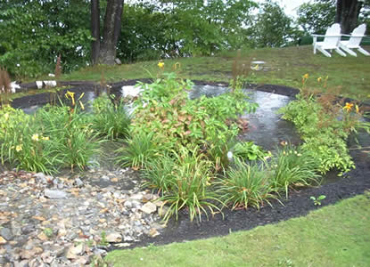 Rain garden at work in Leominster, MA (Photo Credit - MA Watershed Coalition)