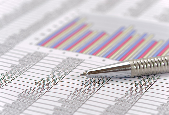 An image of a printed spreadsheet with multiple rows of data and a bar graph