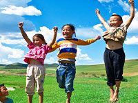children jumping outdoors