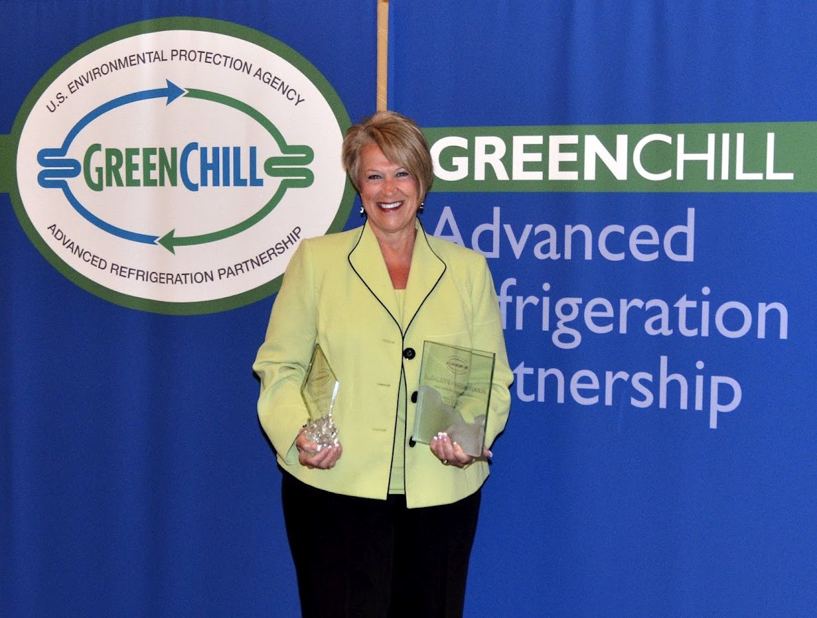 Becky Foster from Buehler's Fresh Foods accepts two awards from GreenChill for the Most Improved Emissions Rate and Goal Achievement