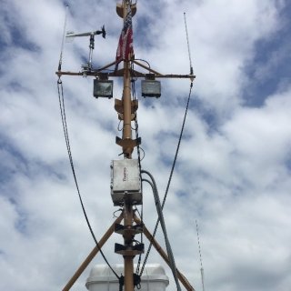 An air monitor is pictured with the sky as a backdrop