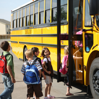 Children boarding a school bus