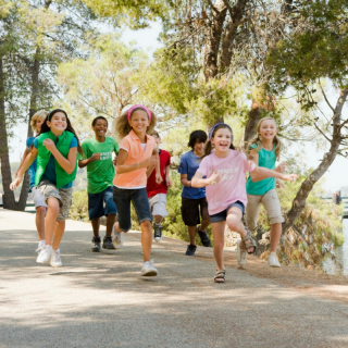 Children running along a path