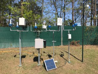 SPods (in blue) are fenceline monitoring devices developed by EPA to measure air pollutant plumes at an industrial facility. EPA scientists tested them at EPA’s research campus in RTP, NC, alongside prototypes designed by commercial developers using the