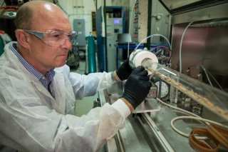 Dr. Ian Gilmour conducting an experiment using the tube furnace located at an EPA laboratory in Research Triangle Park, Noth Carolina.