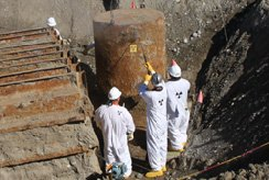 Workers removing a leaking underground storage tank