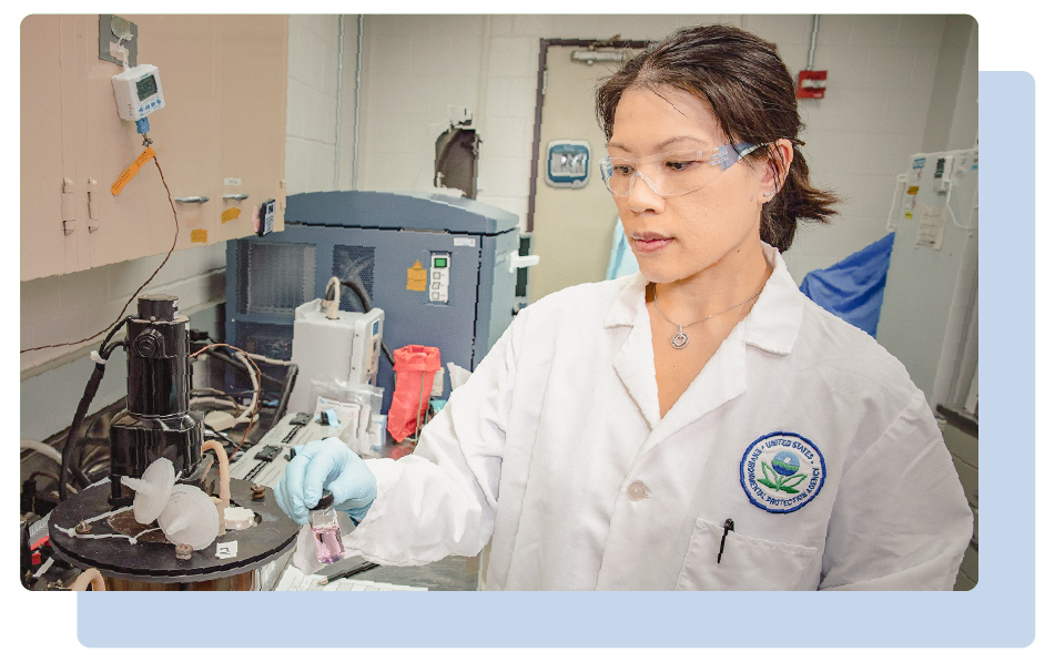 EPA scientist in the lab looking at a sample. 