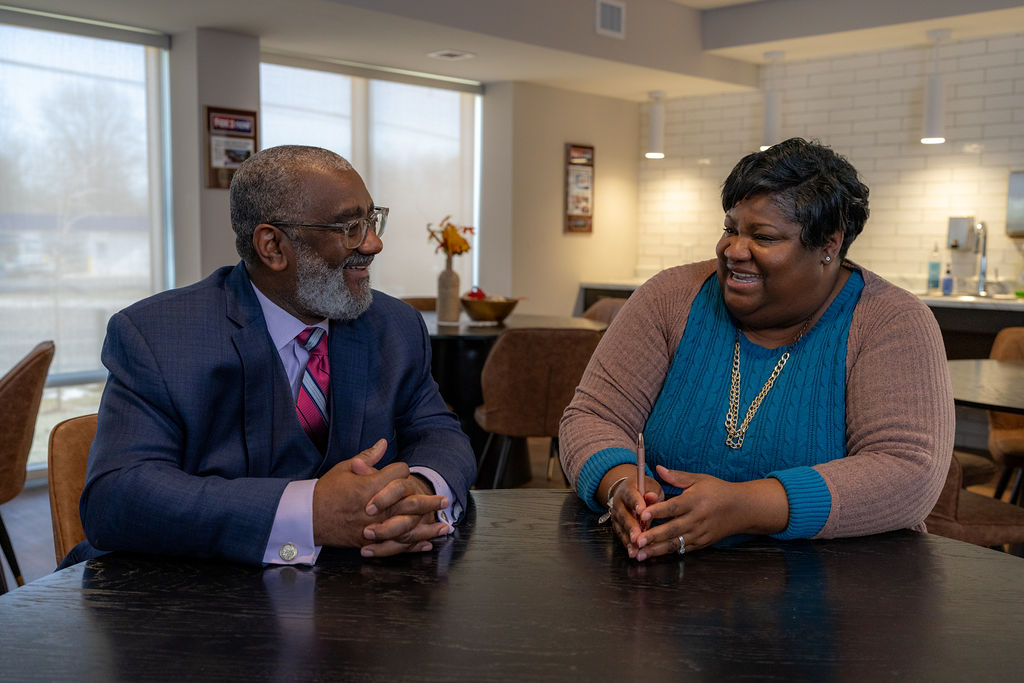 Michael Holmes, Regional Executive Vice President of the Urban League, and Tammie Dawn, Building Manager, sharing a moment together at the Senior Housing Center, where collaboration has made the project a success.