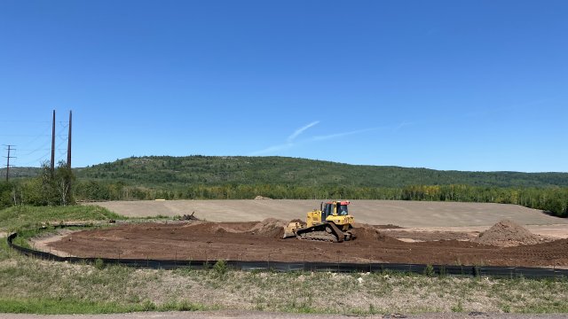 Processed material is placed in the OU-J confined disposal facility (CDF)