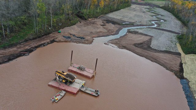 An aerial view of the confluence of the Weir Pond and the restored upstream portion of the Unnamed Creek. 