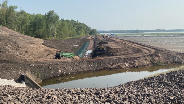 Contractors began restoring the downstream portion of the Unnamed Creek. Green, erosion control fabric is placed in the new Unnamed Creek channel.