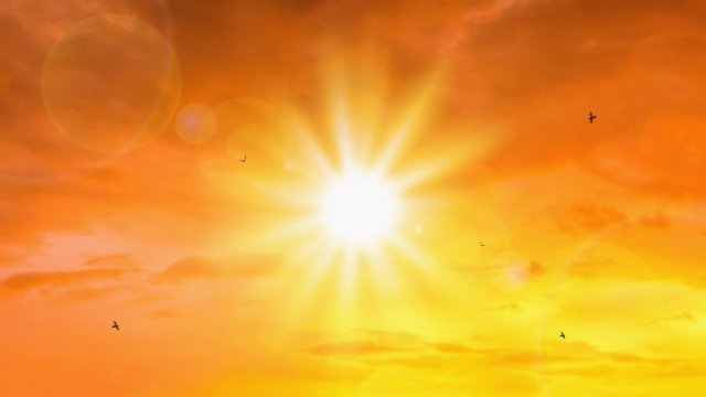 impact of air travel on global warming Hot sun in orange sky