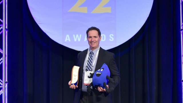 Winner holding WaterSense Award