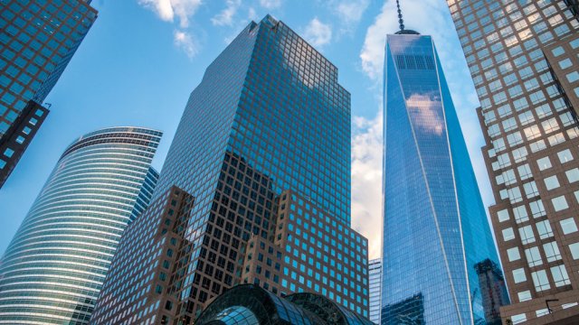 Image looking up at corporate buildings in New York City. 