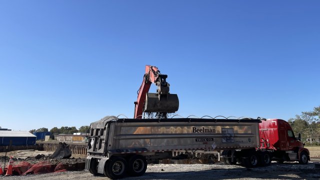 Hazardous soil is loaded for off-site disposal