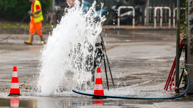 Road spurt water beside traffic cones