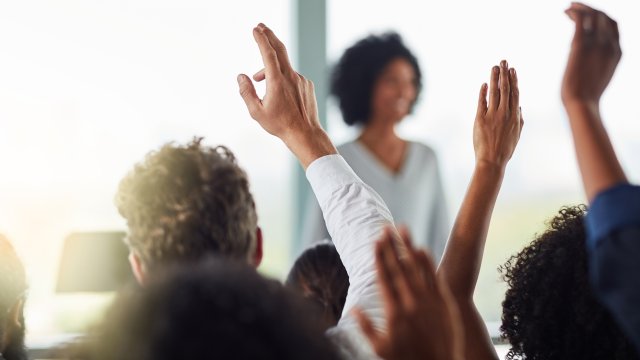 Hands raised in classroom