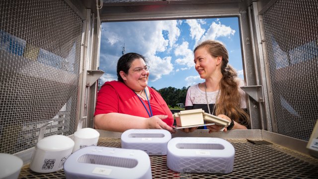 EPA researchers Andrea Clements and Karoline Barkjohn at the RTP AIRS site in 2024.