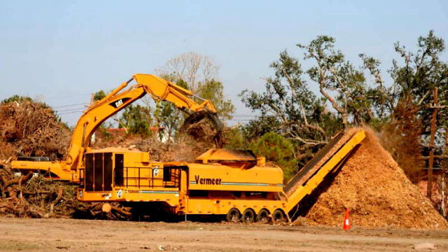 large machine mulching wood