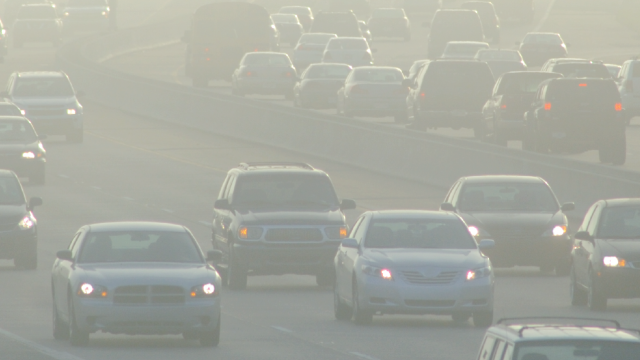 Traffic on smoggy freeway
