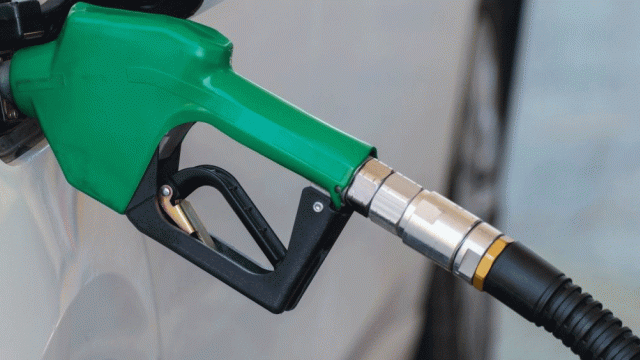  Green gas nozzle fueling car gas tank