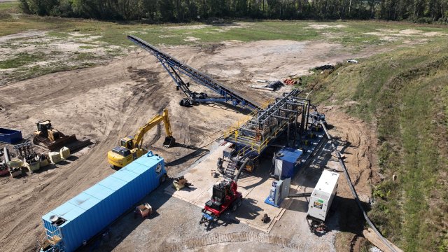 Arial image with construction equipment on bare ground