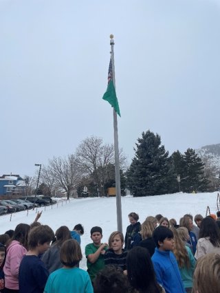 raising air quality flag at a school in Colorado