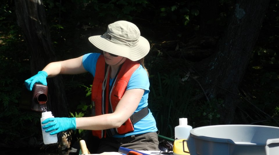 Scientist collects water samples for the National Lakes Assessment.
