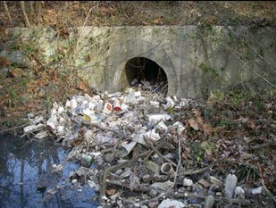 Trash at storm water drain near the Great Lakes