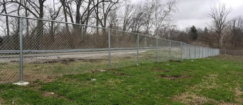 Newly installed chain link fence along Garland Road