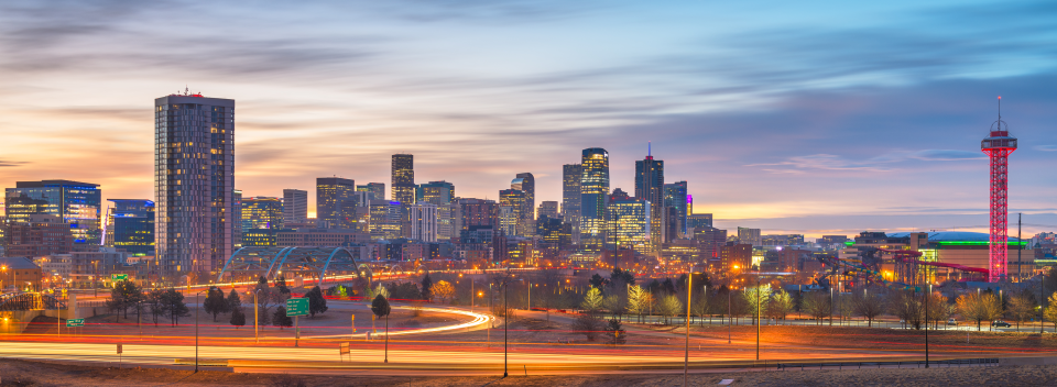 denver skyline against a sunset backdrop