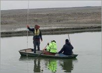 Compliance Advisors conducting a solids inventory at a lagoon in Wyoming.