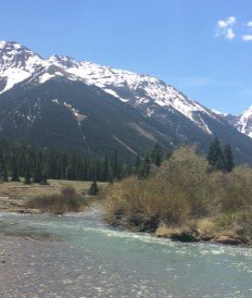 decorative image of a scenic view blue sky and snowcap mountains