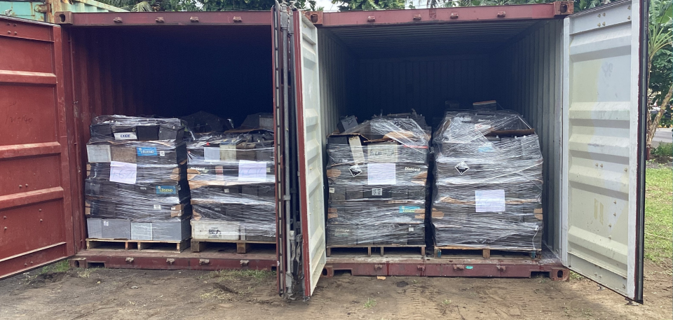 Loaded pallets of lead-acid batteries inside shipping containers