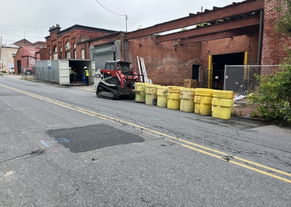 Barrels of hazardous substances wait to be loaded onto disposal truck in Reading, PA.
