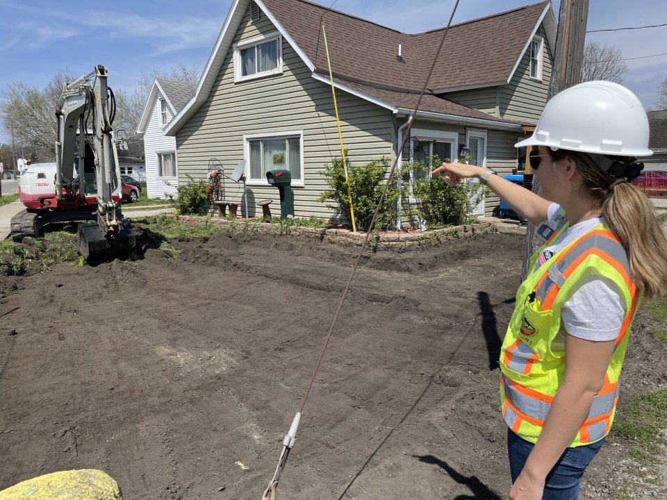 EPA On-Scene Coordinator Lauren Hirschel supervises soil removal at a home near the former Exide site. 