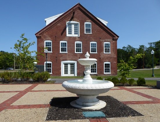 building with a fountain in front