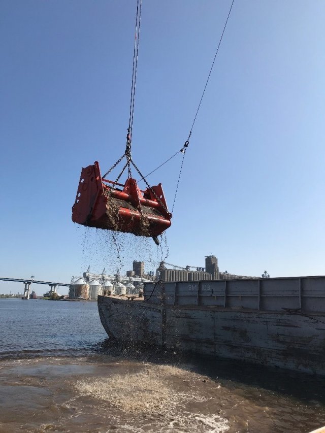 Dredging equipment conducting maintenance dredging in a navigational channel (Photo Credit: U.S. Army Corps of Engineers)