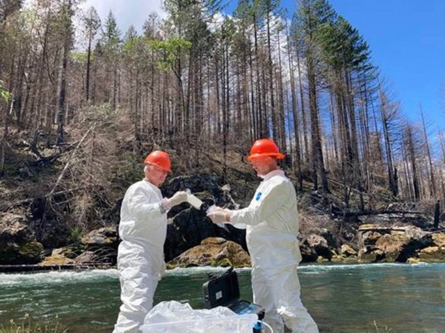 Collecting water samples for mercury analysis after a fire in Oregon (photo credit CSS Inc)