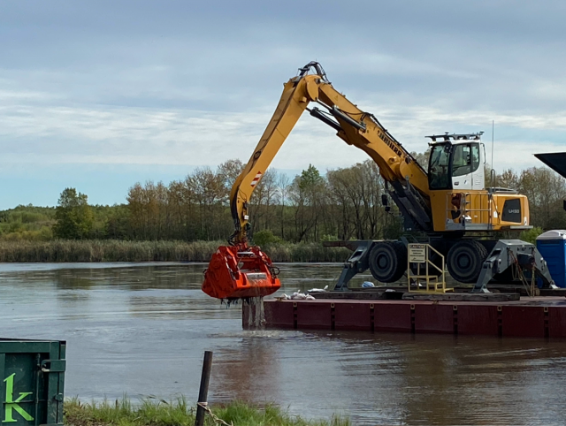 Mechanical dredging of contaminated sediment in the East Pond. (Photo courtesy of U.S. Army Corps of Engineers)