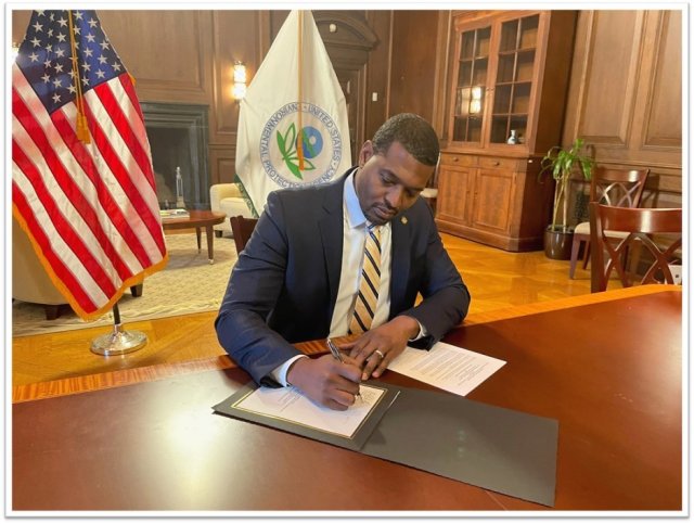 US EPA Administrator Michael S. Regan signs the memorandum of understanding in his office.
