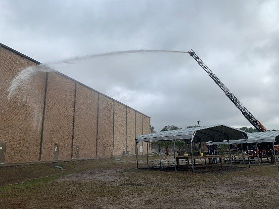 Photo 4: Fire/rescue truck from Glynn County Fire Department in Georgia spraying down a building.