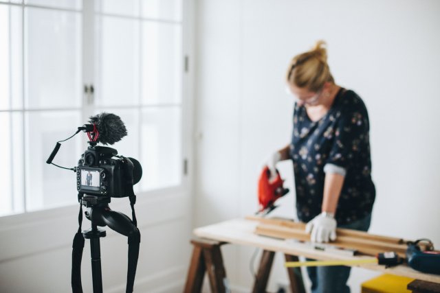 woman filming herself doing a diy project