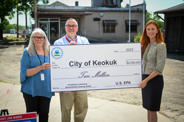 Keokuk Mayor Kathie Mahoney, Keokuk City Administrator Cole O’Donnell, and EPA Region 7 Administrator Meg McCollister pose with ceremonial check